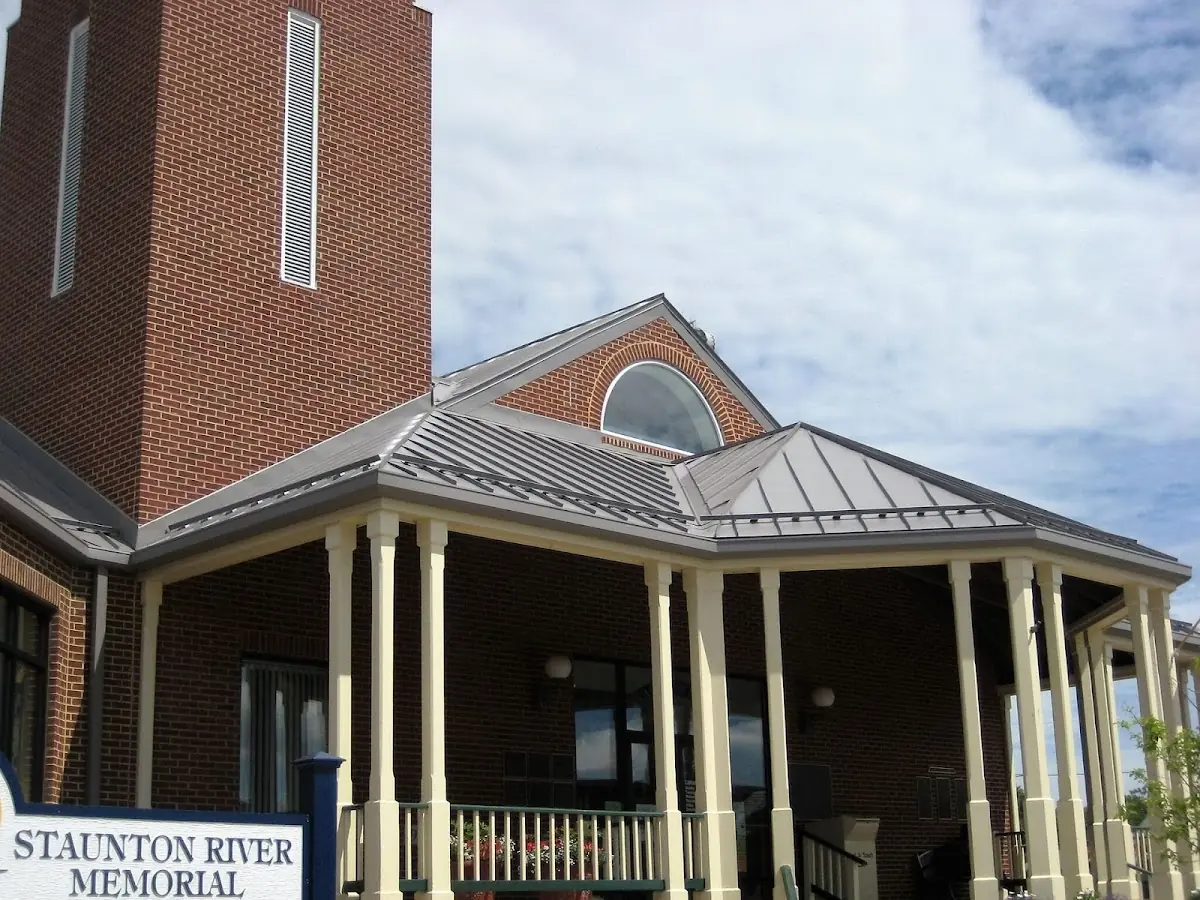 Skilled roofing craftsmen working on a residential roof in Senatobia